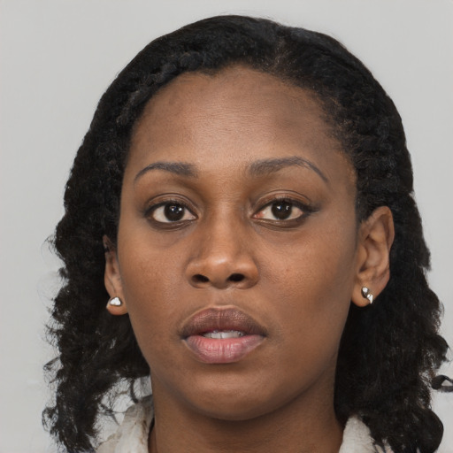 Neutral black young-adult female with long  black hair and brown eyes