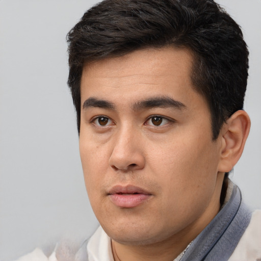 Neutral latino young-adult male with short  brown hair and brown eyes