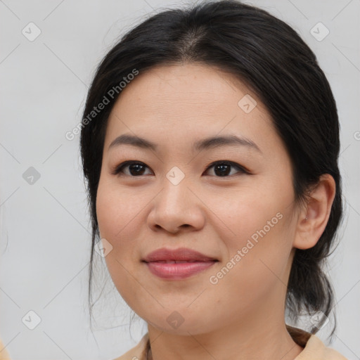 Joyful asian young-adult female with medium  brown hair and brown eyes