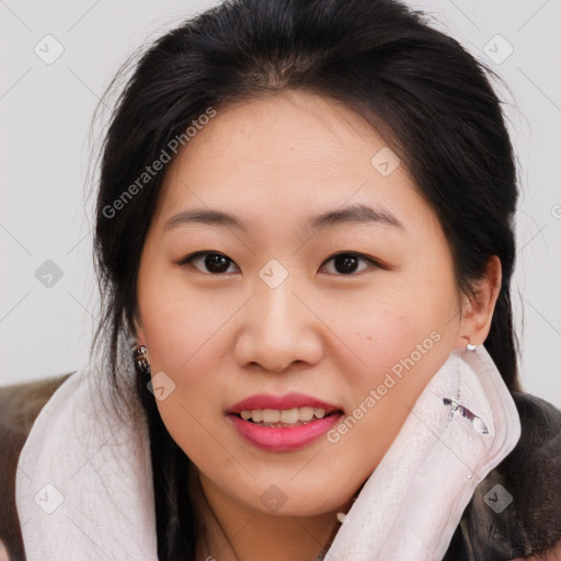 Joyful asian young-adult female with medium  brown hair and brown eyes