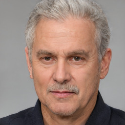 Neutral white middle-aged male with short  gray hair and brown eyes