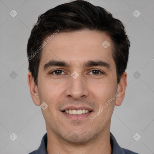 Joyful white young-adult male with short  black hair and brown eyes