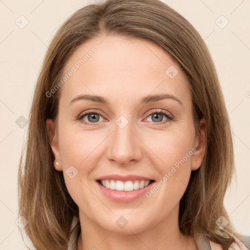 Joyful white young-adult female with long  brown hair and grey eyes