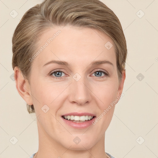 Joyful white young-adult female with short  brown hair and grey eyes