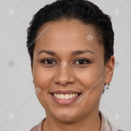 Joyful latino young-adult female with short  brown hair and brown eyes