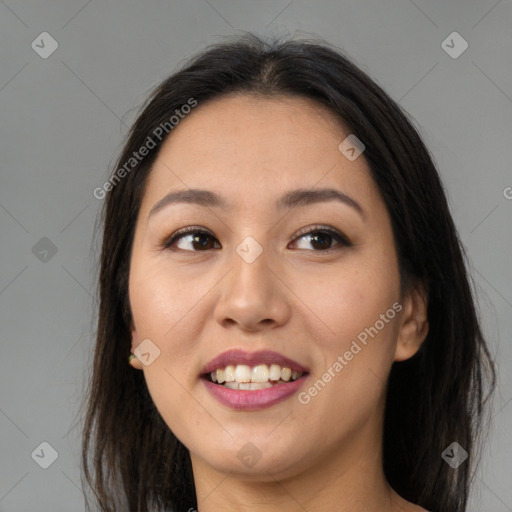 Joyful asian young-adult female with long  brown hair and brown eyes