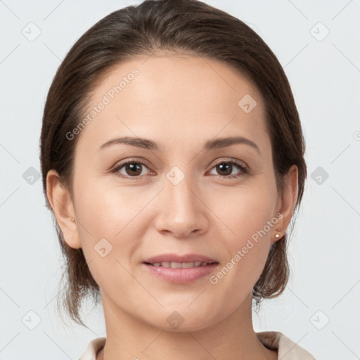 Joyful white young-adult female with medium  brown hair and brown eyes