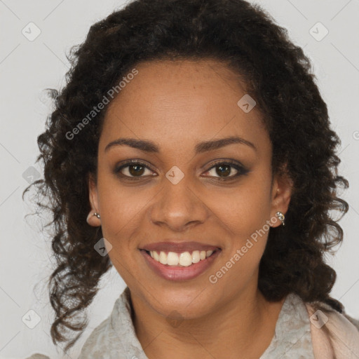 Joyful black young-adult female with long  brown hair and brown eyes