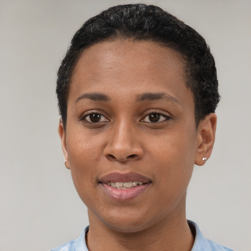 Joyful latino young-adult female with short  black hair and brown eyes