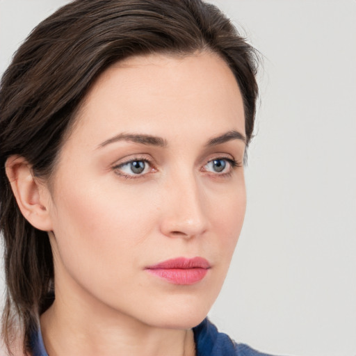 Neutral white young-adult female with medium  brown hair and blue eyes