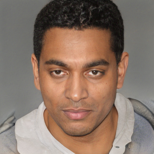 Neutral black young-adult male with short  black hair and brown eyes