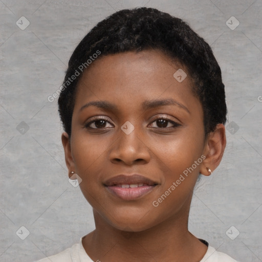 Joyful black young-adult female with short  black hair and brown eyes