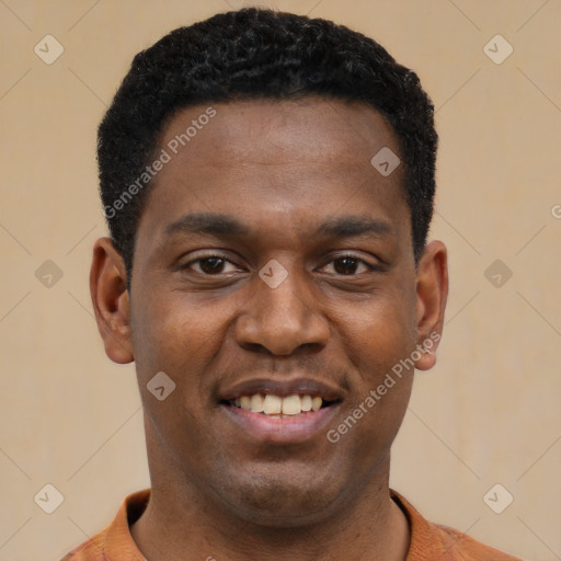 Joyful black young-adult male with short  black hair and brown eyes