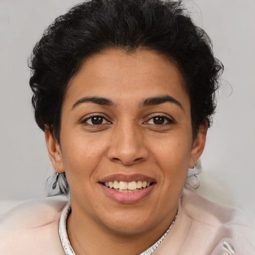 Joyful latino young-adult female with short  brown hair and brown eyes