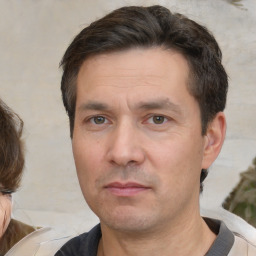 Neutral white adult male with short  brown hair and brown eyes