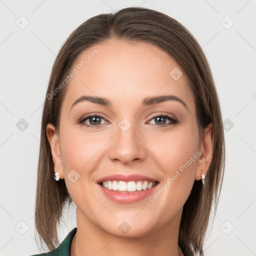 Joyful white young-adult female with long  brown hair and grey eyes