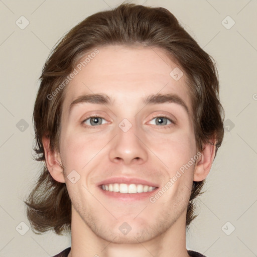 Joyful white young-adult male with medium  brown hair and grey eyes