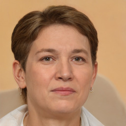 Joyful white adult female with short  brown hair and brown eyes