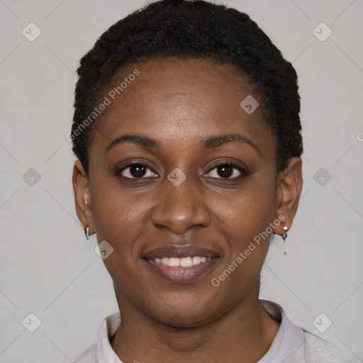 Joyful black young-adult female with short  black hair and brown eyes