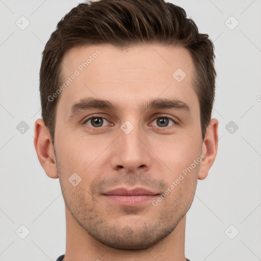 Joyful white young-adult male with short  brown hair and grey eyes