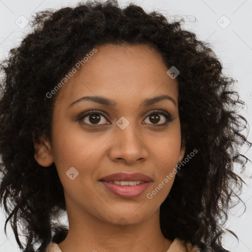 Joyful black young-adult female with long  brown hair and brown eyes