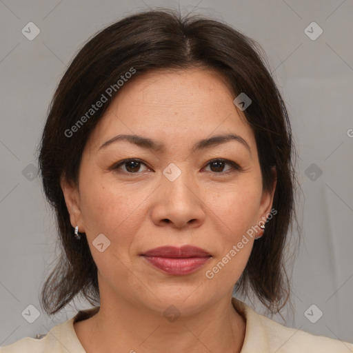 Joyful asian adult female with medium  brown hair and brown eyes