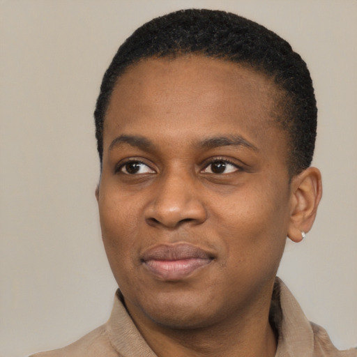 Joyful black young-adult male with short  black hair and brown eyes
