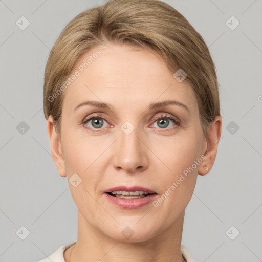 Joyful white adult female with short  brown hair and grey eyes