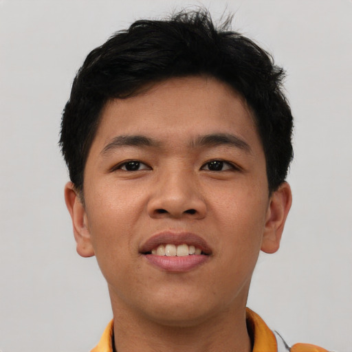 Joyful asian young-adult male with short  brown hair and brown eyes