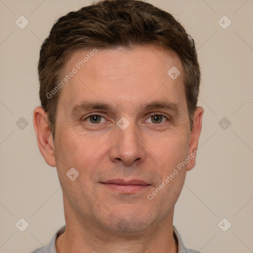 Joyful white adult male with short  brown hair and grey eyes