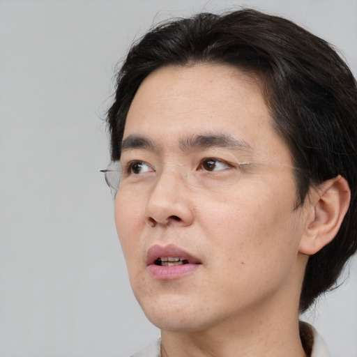 Neutral asian adult male with short  black hair and brown eyes