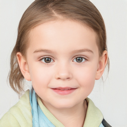 Joyful white child female with medium  brown hair and blue eyes