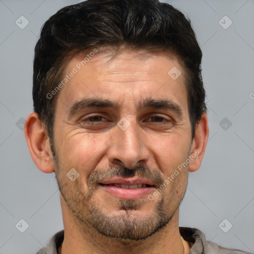 Joyful white adult male with short  brown hair and brown eyes