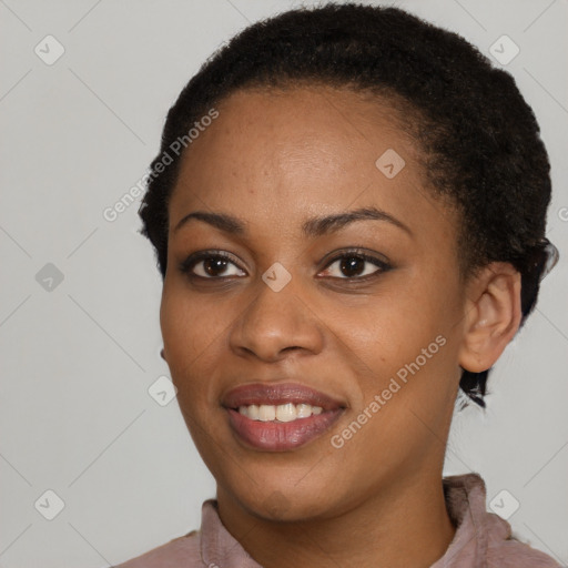 Joyful black young-adult female with short  black hair and brown eyes