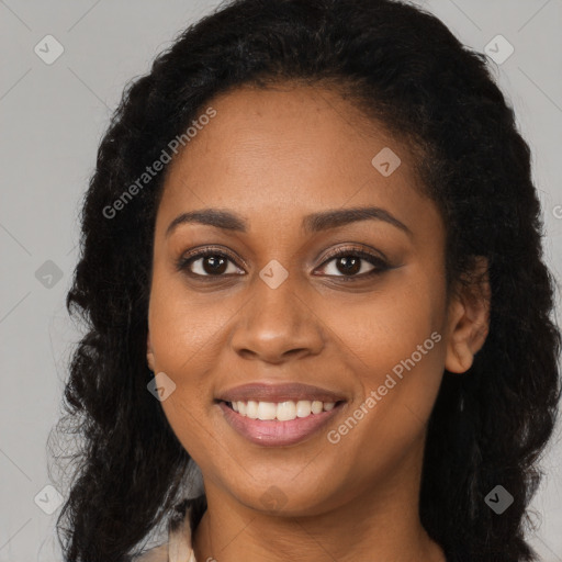 Joyful black young-adult female with long  brown hair and brown eyes