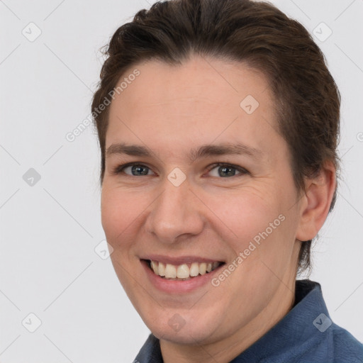 Joyful white adult female with short  brown hair and brown eyes