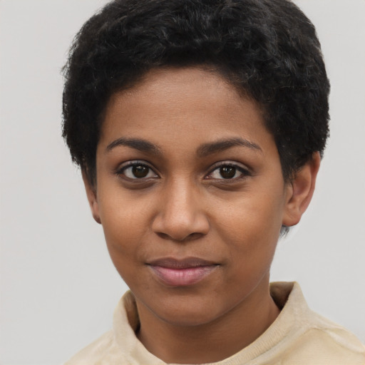 Joyful black young-adult female with short  brown hair and brown eyes