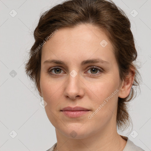 Joyful white young-adult female with medium  brown hair and green eyes