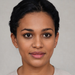 Joyful latino young-adult female with short  brown hair and brown eyes