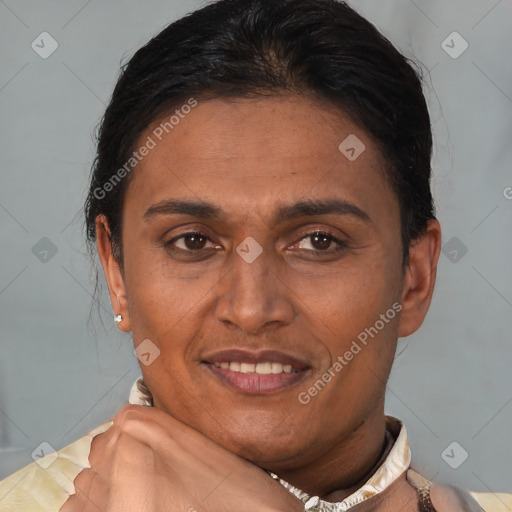 Joyful latino adult female with short  brown hair and brown eyes