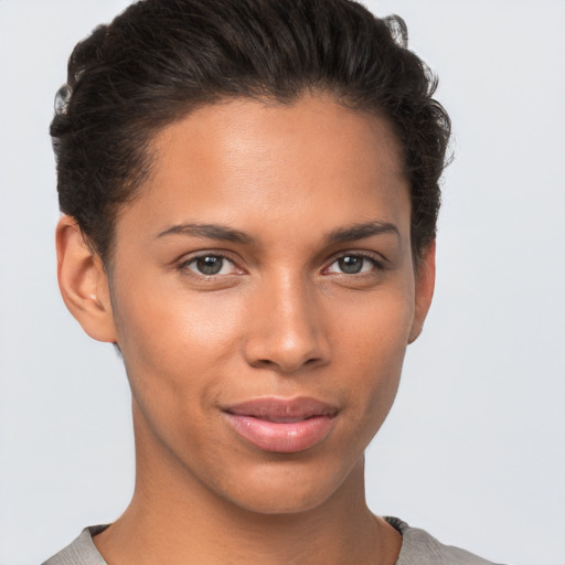 Joyful white young-adult female with short  brown hair and brown eyes