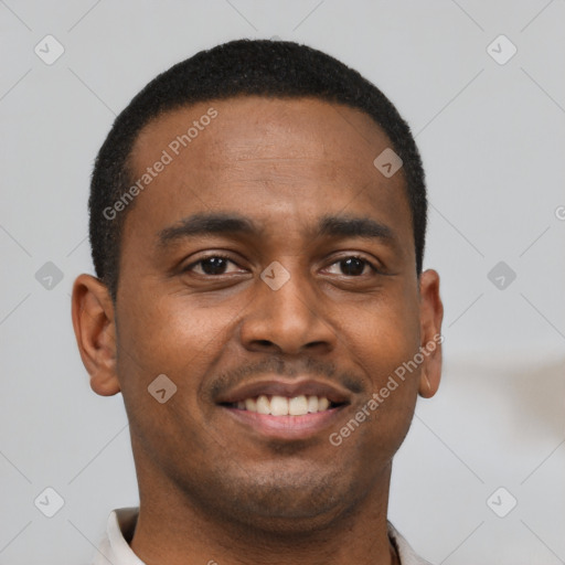 Joyful black young-adult male with short  brown hair and brown eyes
