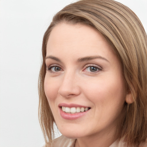 Joyful white young-adult female with long  brown hair and grey eyes