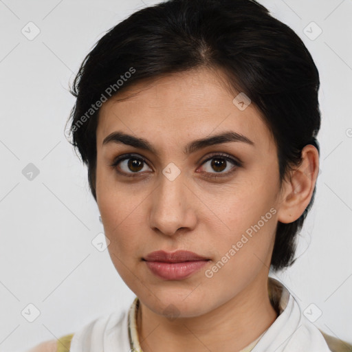 Joyful latino young-adult female with medium  brown hair and brown eyes