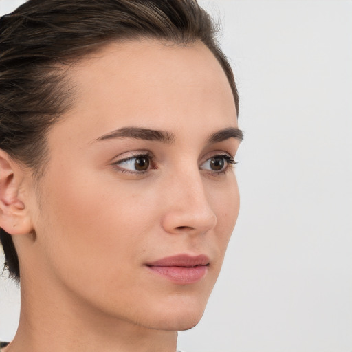 Neutral white young-adult female with medium  brown hair and brown eyes