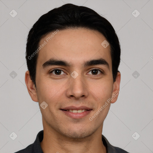 Joyful white young-adult male with short  black hair and brown eyes