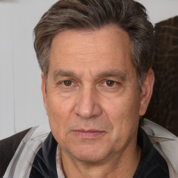 Joyful white middle-aged male with short  brown hair and brown eyes