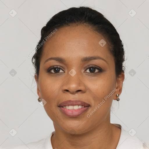 Joyful black young-adult female with short  black hair and brown eyes