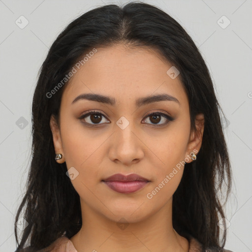 Joyful latino young-adult female with long  brown hair and brown eyes