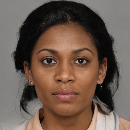 Neutral black young-adult female with medium  black hair and brown eyes